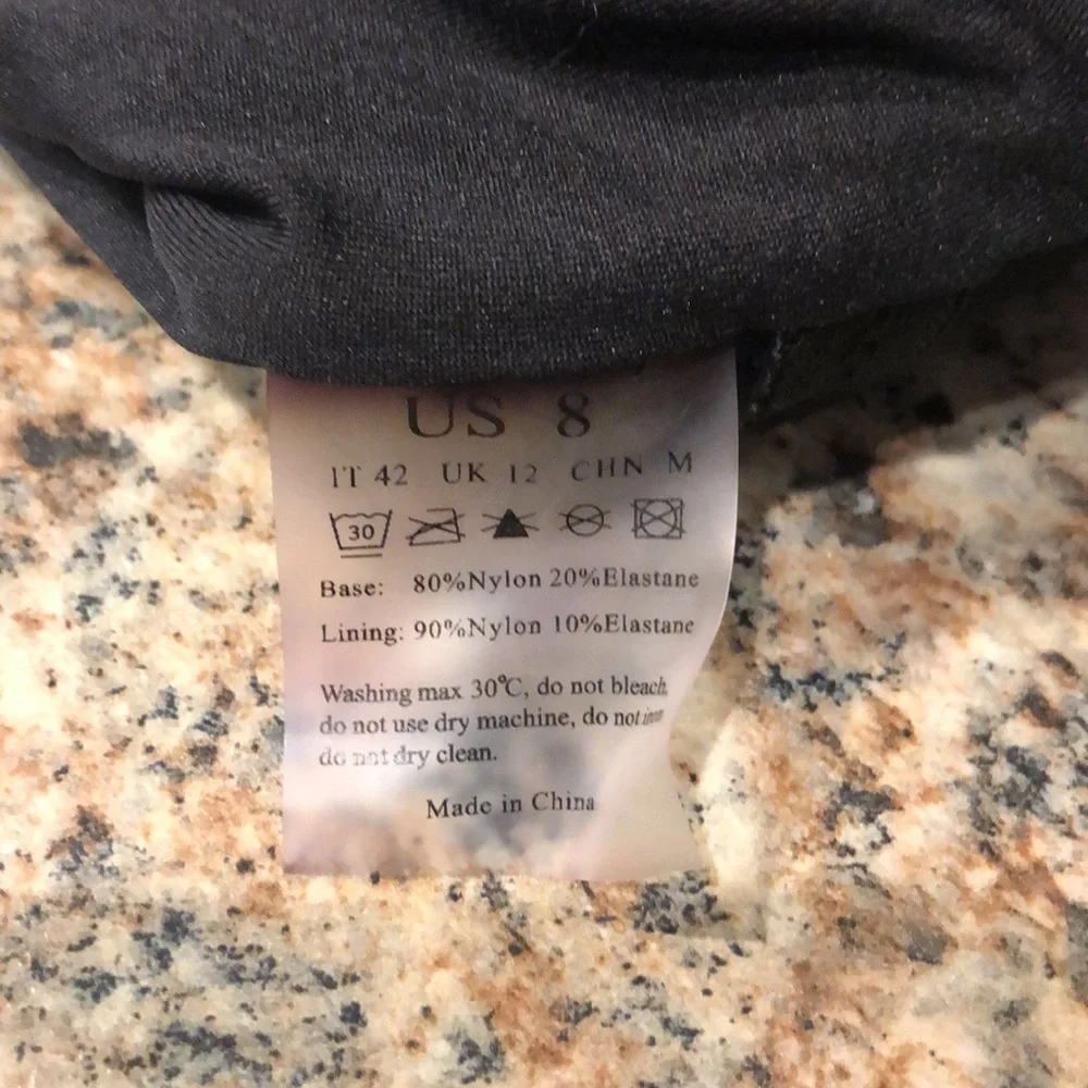 NWOT Black & White Women’s  Size 8 Swimsuit w/adj straps & removable bra pads.